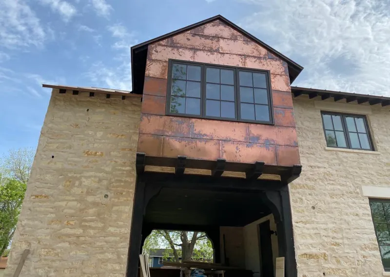 Copper metal panel facade on a stone building for Metal Roof Coating in West Milford